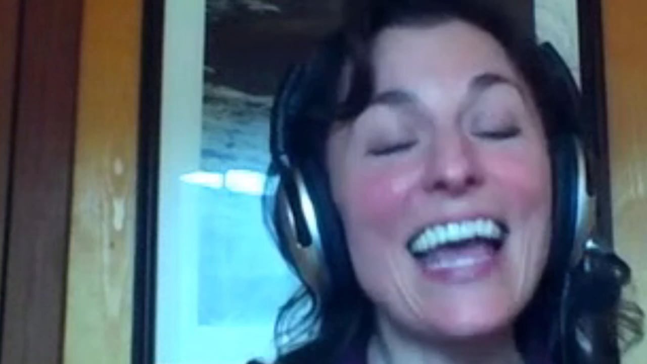Christy speaking to camera in her video testimonial